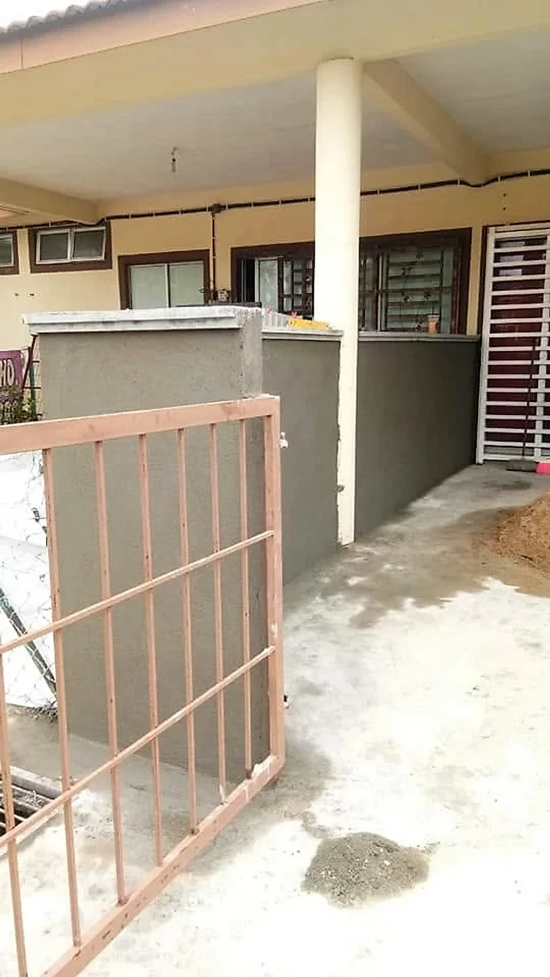 New fence pillar and wall beside the front gate