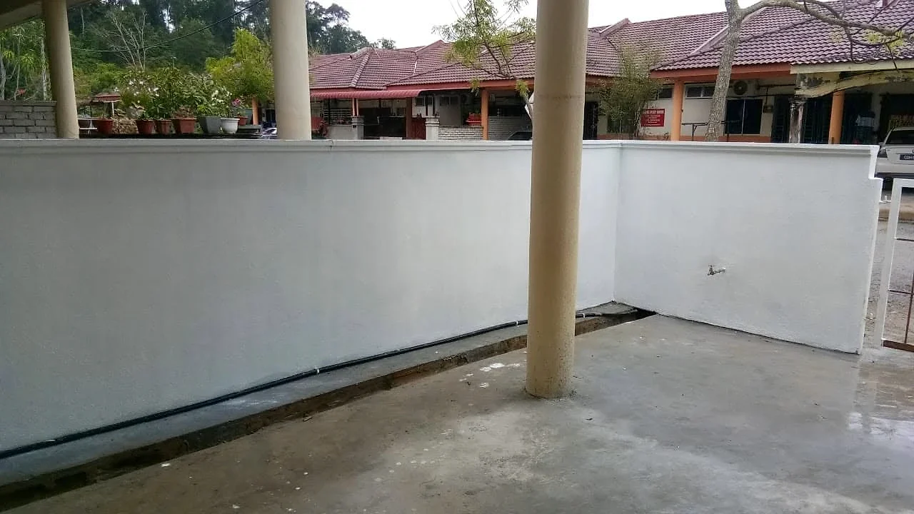 Finished fence wall painted white around the porch