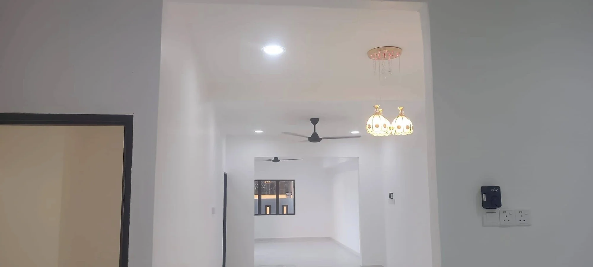 Interior archway with downlights, ceiling fan and pendant lights