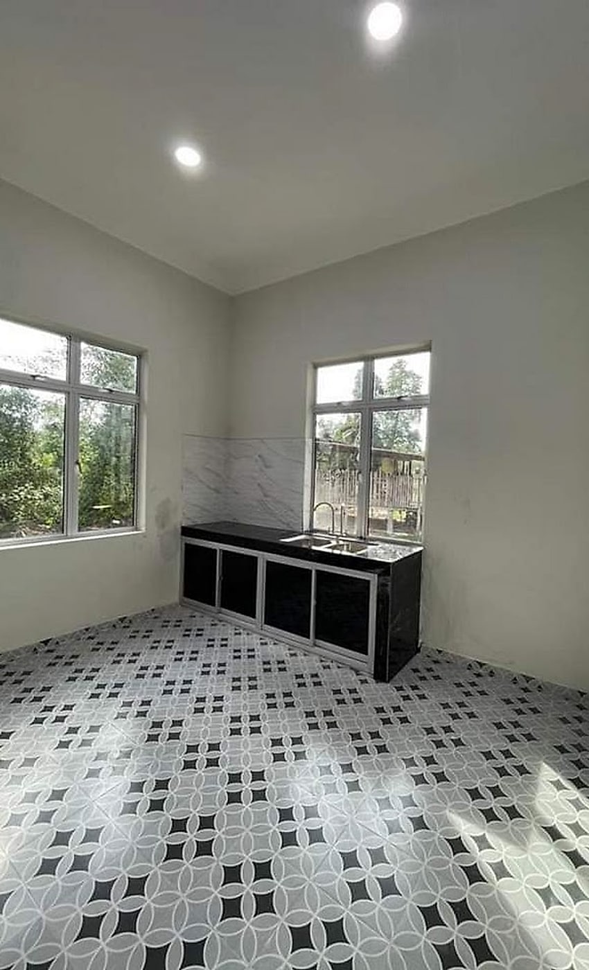 Kitchen with patterned tiles and new counter
