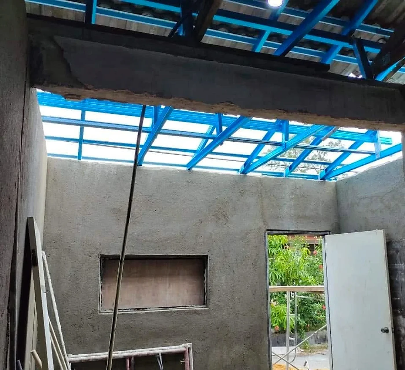 Plastered kitchen walls under a new light steel roof frame