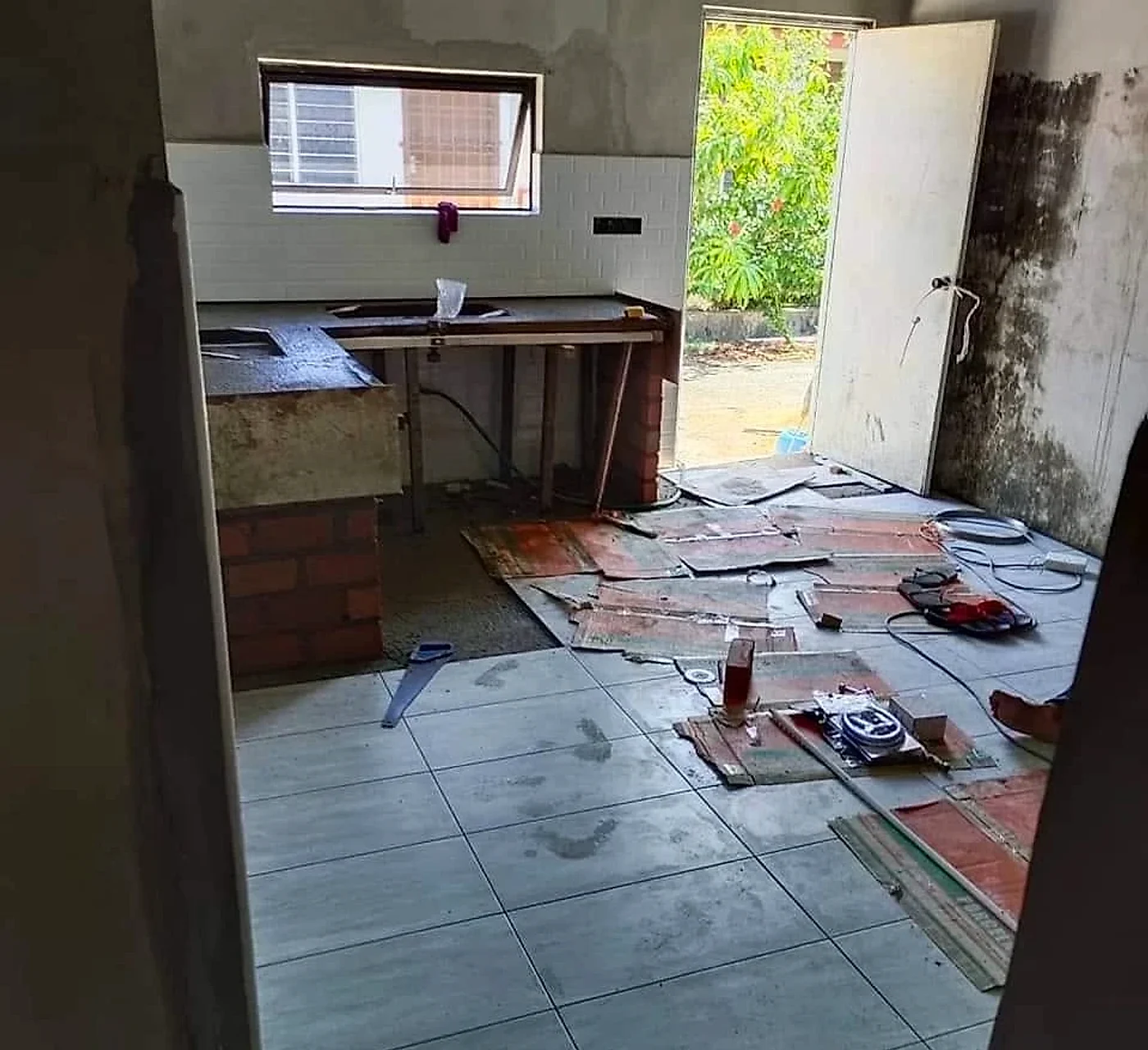Floor tiles being laid in the new kitchen