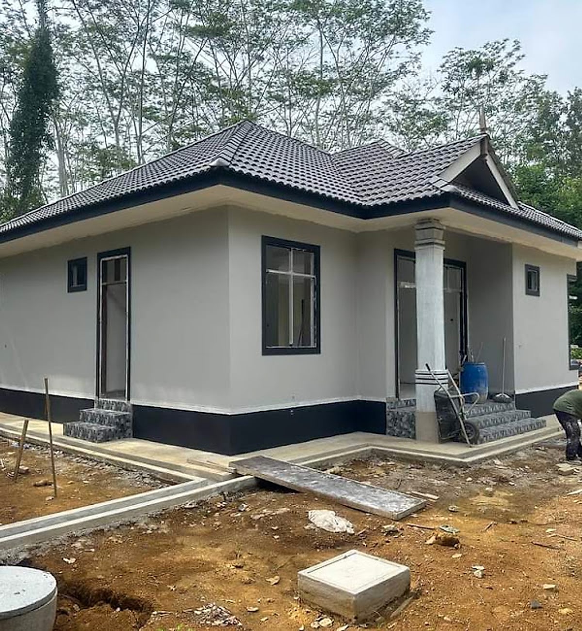 Rear corner of a gabled bungalow with the concrete apron poured
