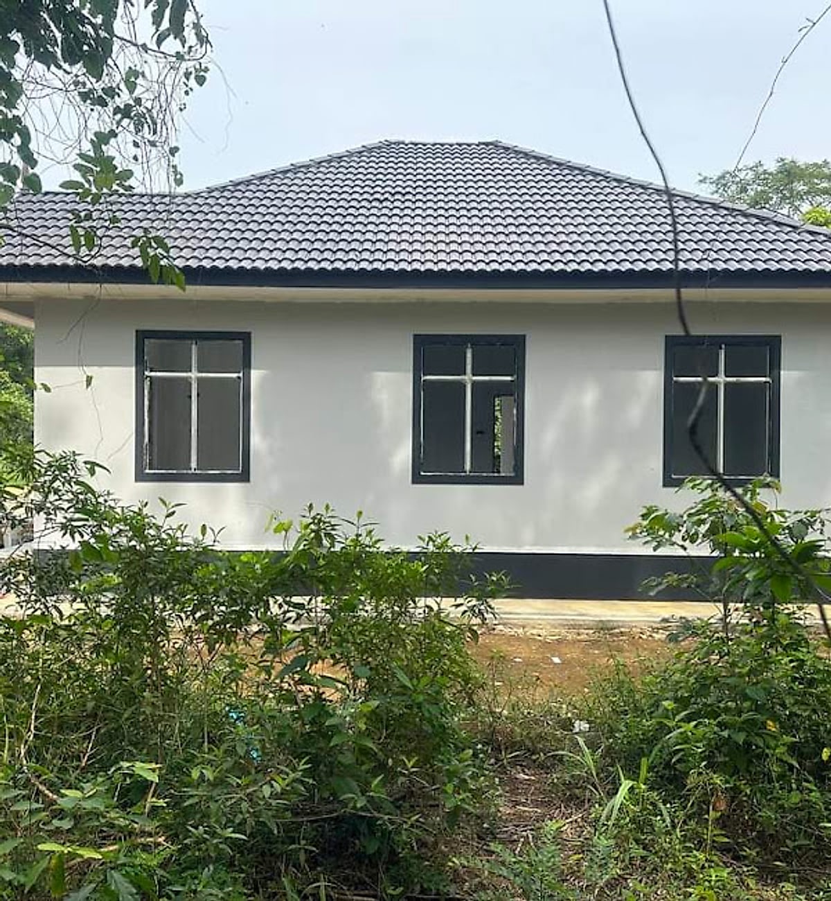 Side elevation of the bungalow under a hip roof