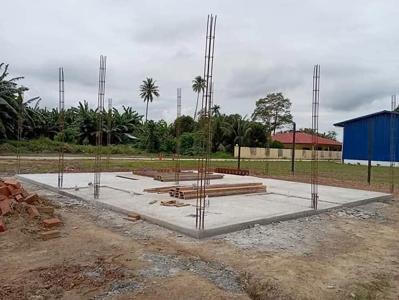 Finished concrete slab with column starter bars