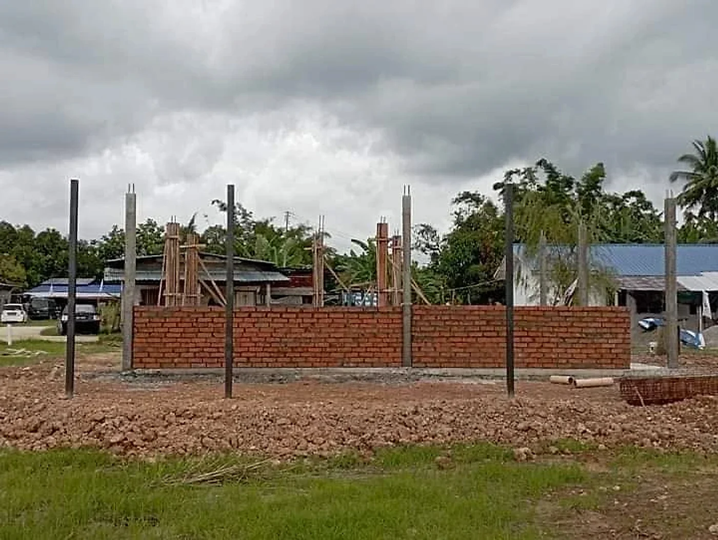 First courses of brick walls between the new columns