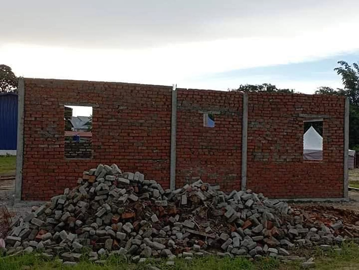 Brick walls up to beam level with window openings