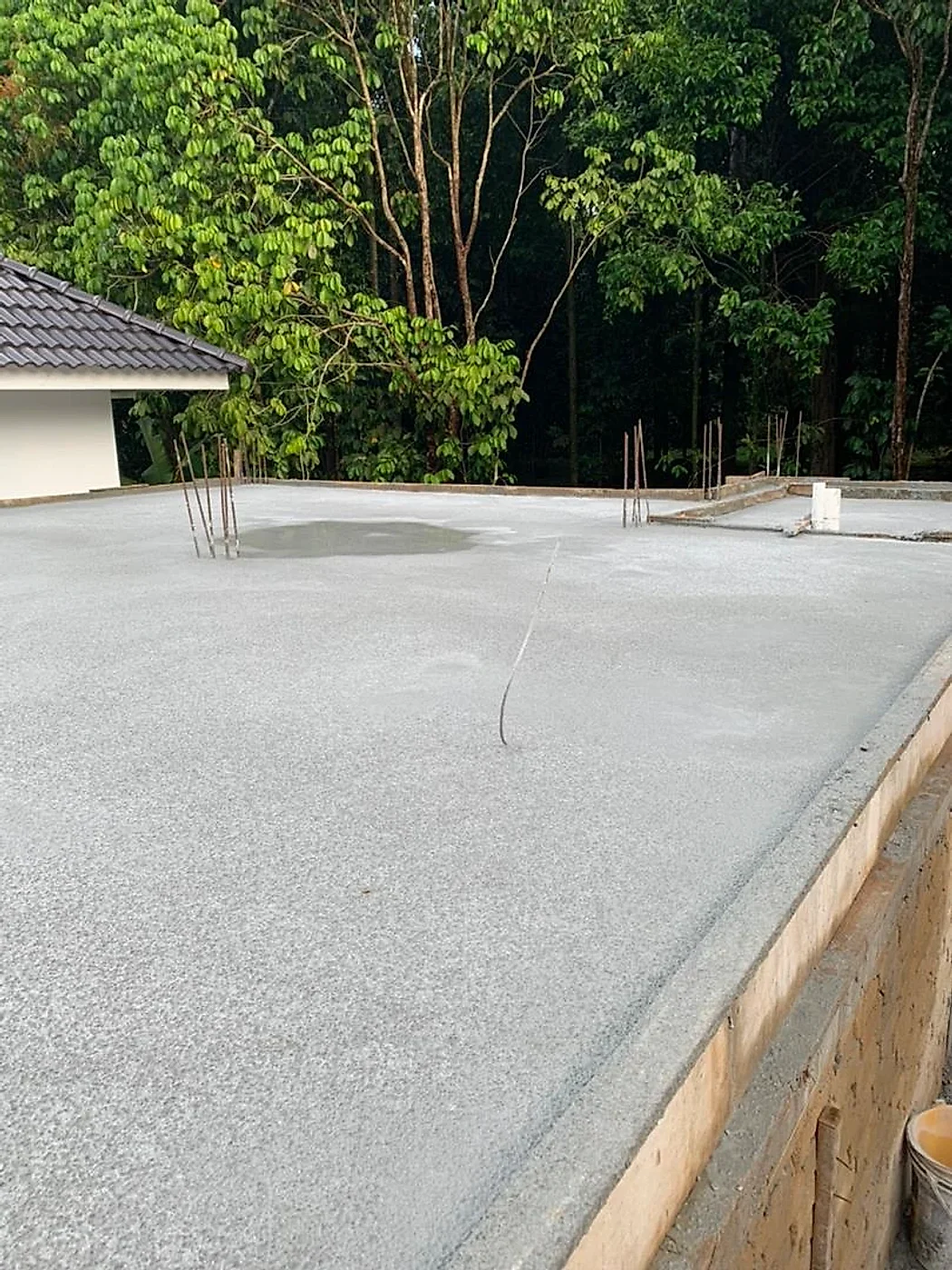 Freshly poured first-floor slab for the raised wing