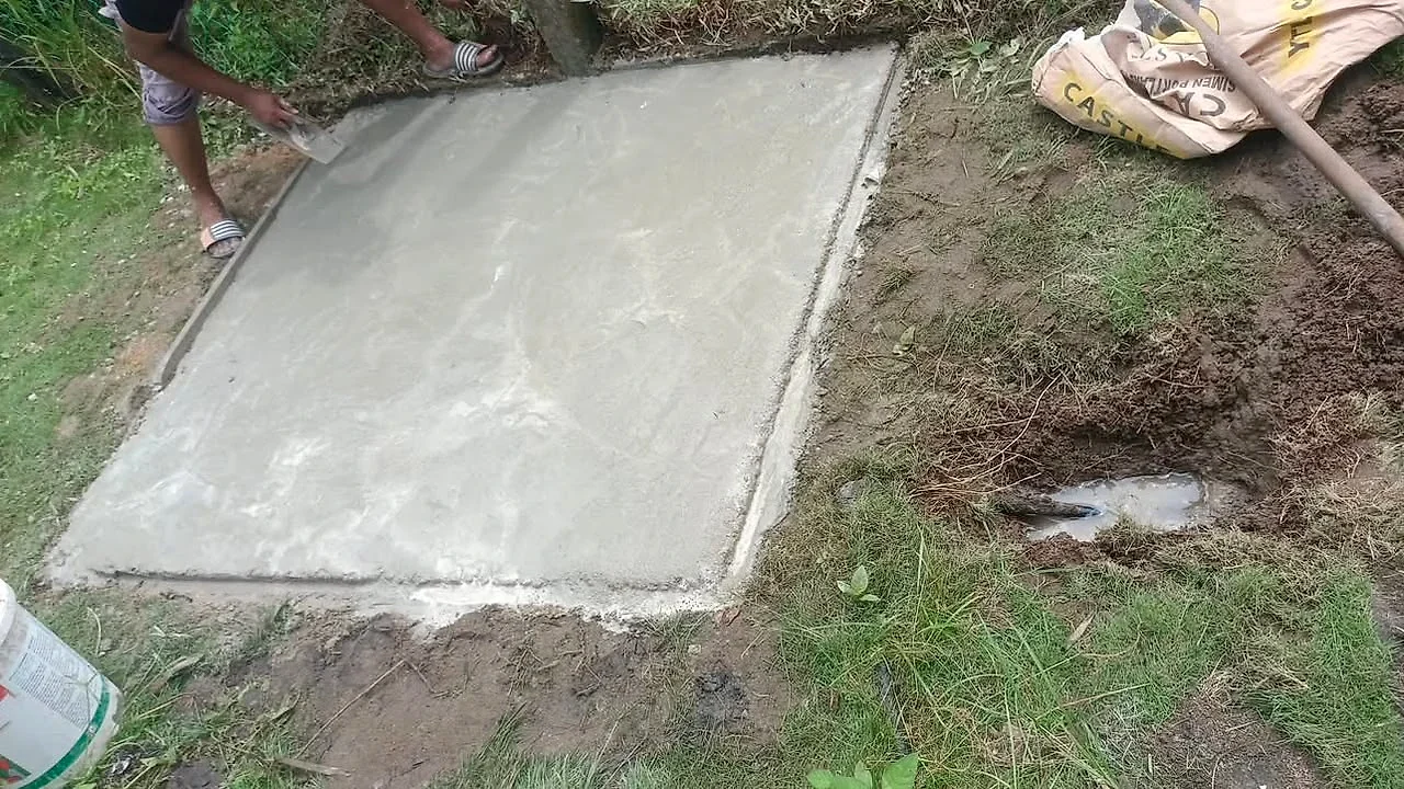 Concrete base being levelled for a new water tank